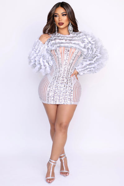 Model wearing Phenom sheer mini dress